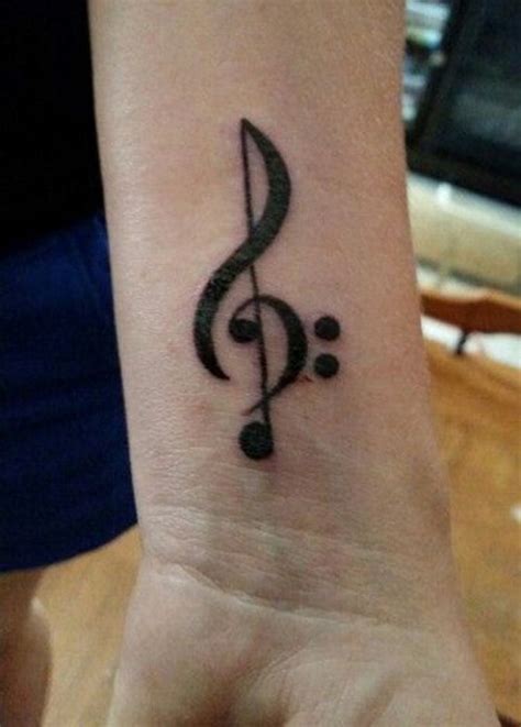 This symbol is a classic tattoo choice for music lovers. 50 Treble Clef Tattoos | Music tattoo designs, Treble clef tattoo, Music symbol tattoo