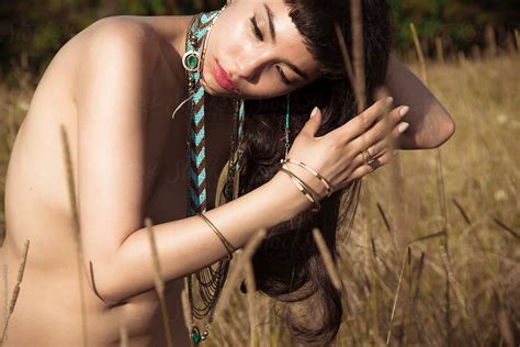Nude Woman With Jewelry In Field By Stocksy Contributor Sari Wynne
