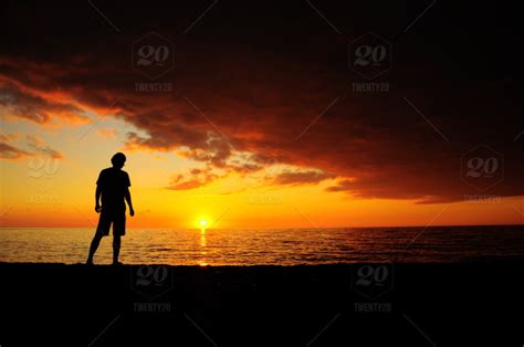 Silhouette Of Man Looking At Sunset Stock Photo 9b0535a2