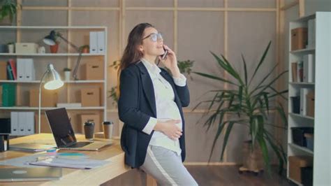 happy attractive office worker a pregnant woman wearing glasses workplace stock footage