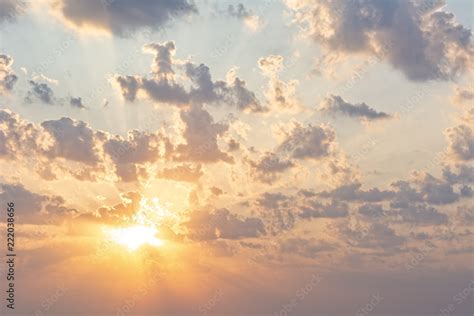 Early Morning Sky Scene With Golden Sun Clouds And Light Rays Stock