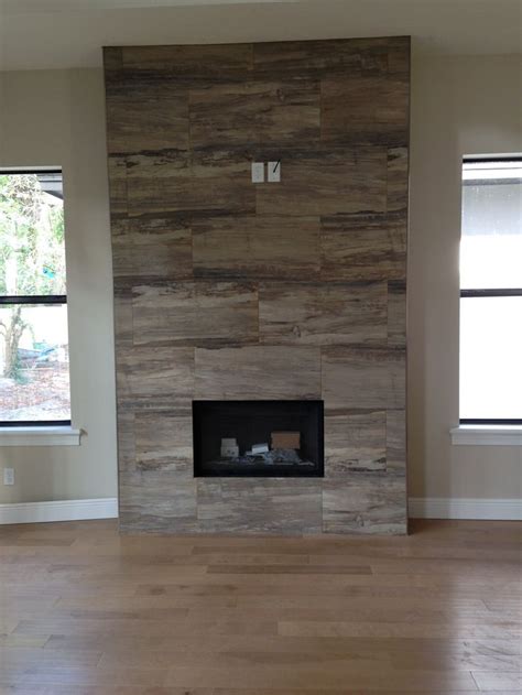 Because wood is flammable, it is not the best material to use around a working fireplace. wood tile orlando - Google Search | Fireplace tile ...