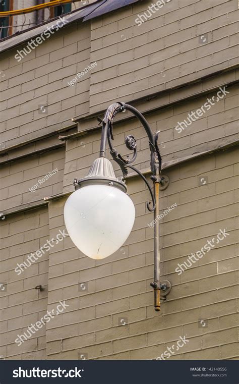 Vintage Street Lamp Against The Wall Of The House Stock Photo 142140556