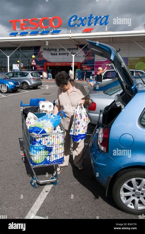 Tesco Extra Supermarket Store Car Park Customer Loading Shopping Into