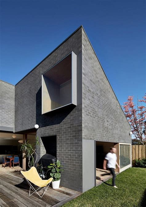 This Black Brick House Features Generous Spaces With A High Degree Of