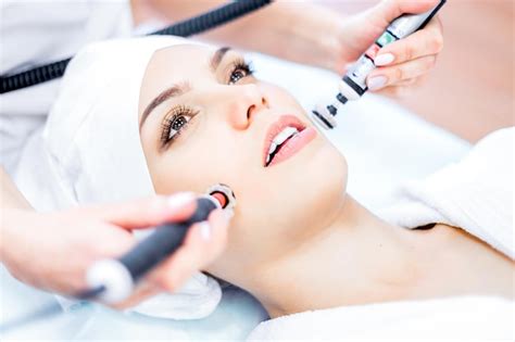 Premium Photo Cosmetology Perform Microcurrent And Ultrasound