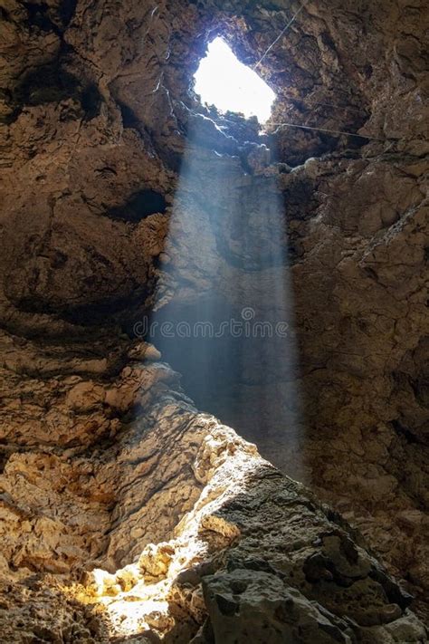The Sun Beam Light Through Hole In The Cave At Thailand Stock Image