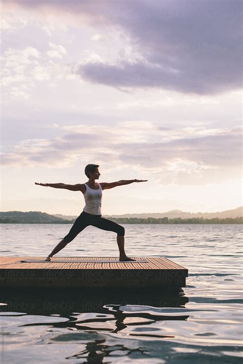 Woman Doing Yoga Outdoors By Stocksy Contributor Michela Ravasio Stocksy