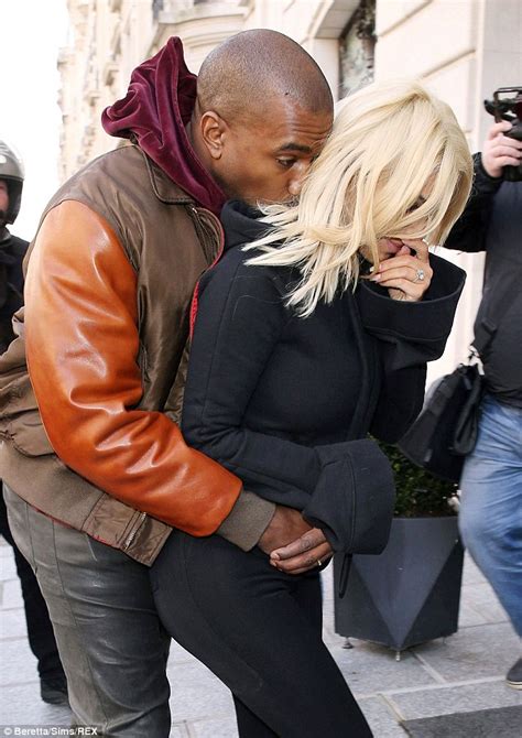 kim kardashian gets the giggles as over amorous kanye west makes a grab for her famous derriere