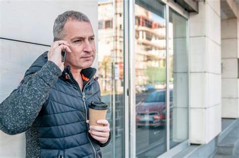 Premium Photo Close Up Portrait Of Happy Mature Guy Talking On Cell Phone And Smiling