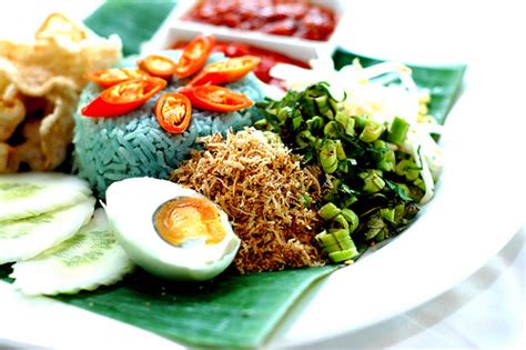 A thin gulai or curry is paired with the rice. nasi lemak