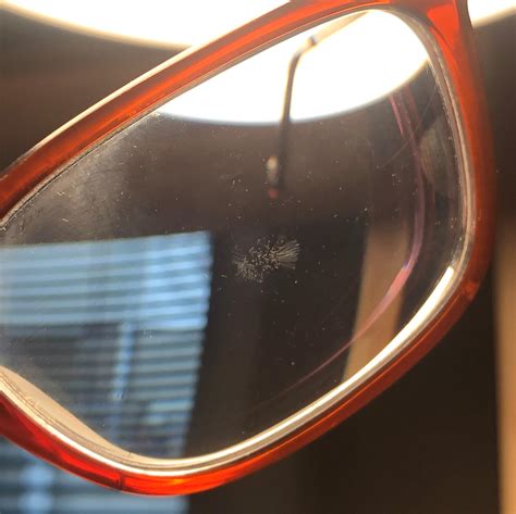 what is this defect in my glasses lens it is not a surface scratch and happened in both lenses