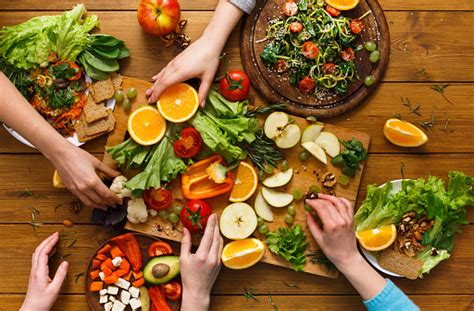 Do you find yourself scoffing at organic produce prices or end up spending more than you wanted each time you head to the grocery store? Dinner Table Women Eat Healthy Food At Home Kitchen Stock ...