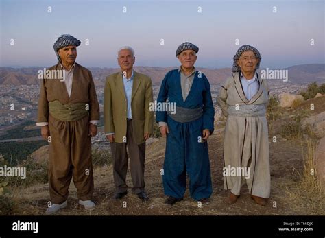 Kurdish Men Wearing Traditional Clothes Take In The View Of Dohuk