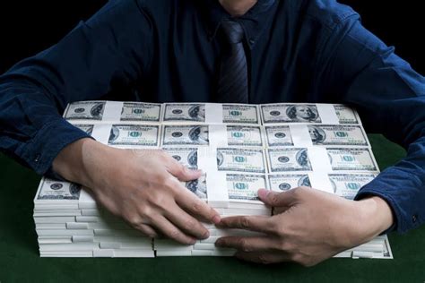 The Rich Man Hugging The Bundles Of Dollars Stock Photo Image Of
