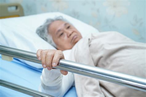 Premium Photo Asian Senior Or Elderly Old Woman Patient Lie Down Handle The Rail Bed With Hope