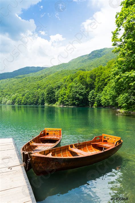 Wooden Boats At Pier On Mountain Lake Stock Photo Crushpixel
