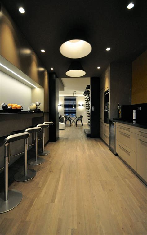 Some rooms even have subtle hints of color such as that blue vintage cabinet from the kitchen/dining room or those pale pink pillows from the bedroom. Luxury Interior Design for Duplex Apartment Near Parc ...
