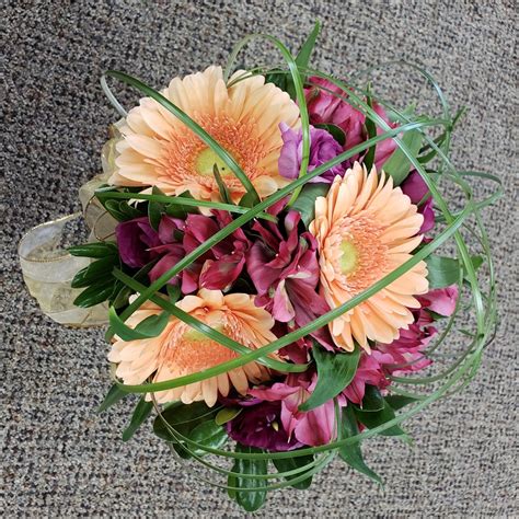 Peach gerbera daisies purple alstromaria hand tied bouquet | Hand tied bouquet, Gerbera daisy 