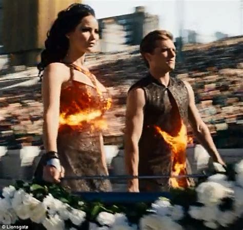 Watch Katniss And Peeta Fake It For The Cameras In First Hunger Games