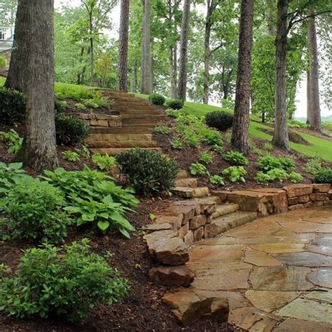 A Stone Path In The Woods With Steps Leading Up To It