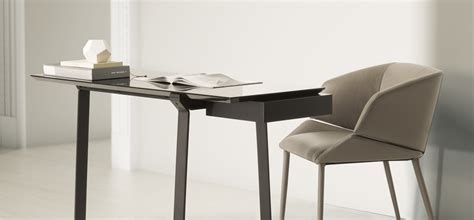 When a console table with storage is topped with a pair of lamps and a mirror, your good taste is well reflected. Modern Desks and console tables | NATUZZI ITALIA