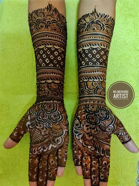 Photo Of Hands Full Of Intricate Traditional Mehndi Designs
