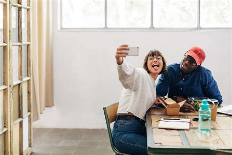 Creative Business People Taking A Selfie While Having Lunch Break At