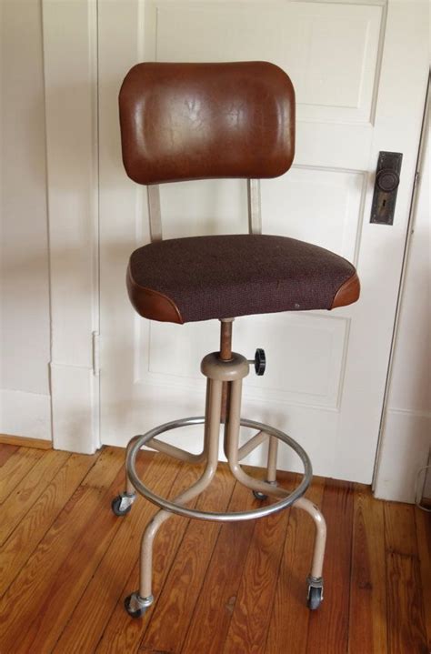 Drafting chairs are ergonomic office chairs with a few modifications, such as a elongated base & foot rest. Antique Drafting Stool - Stools Item
