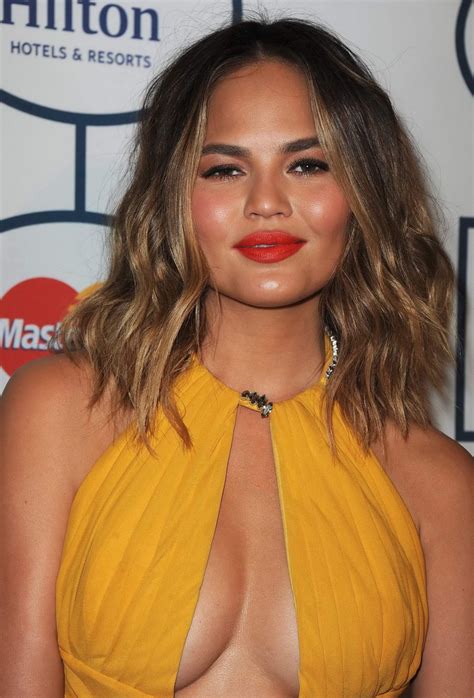 Chrissy Teigen Showing Huge Cleavage At The 56th Annual