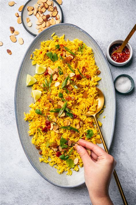 Turmeric Rice With Quick Pickled Golden Raisins And Toasted Almonds