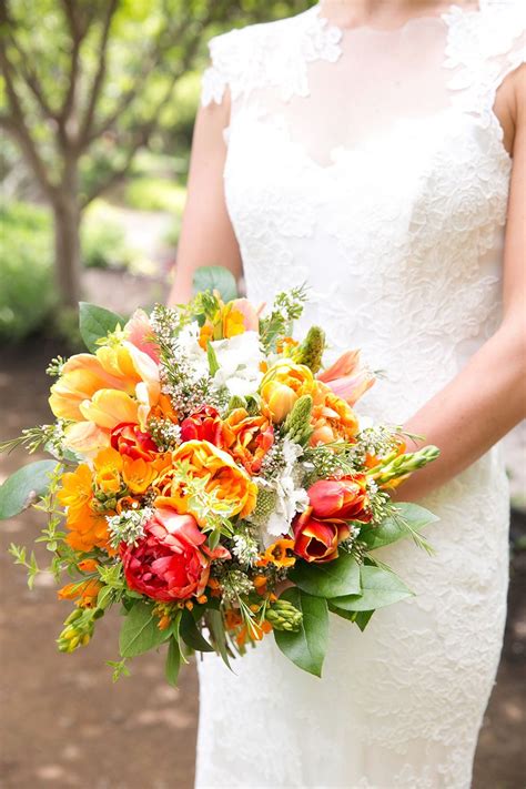 Couple portraits at the faulkner in jackson, mississippi bouquets for wedding at summerour studio in atlanta, georgia protea bouquet for wedding at saddle wood farms in murfreesboro, tennessee Bright + Cheerful Winery Wedding | Bridal bouquet coral ...