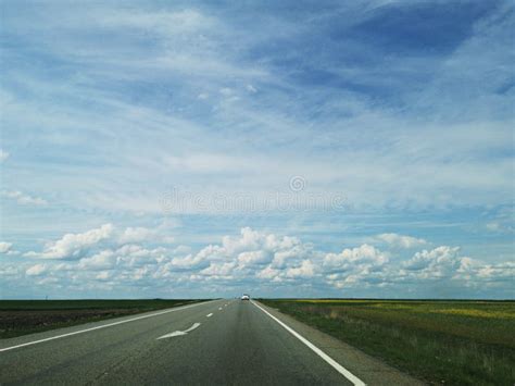 Blue Sky And Road Through Fields Of Stock Photo Image Of Perspective