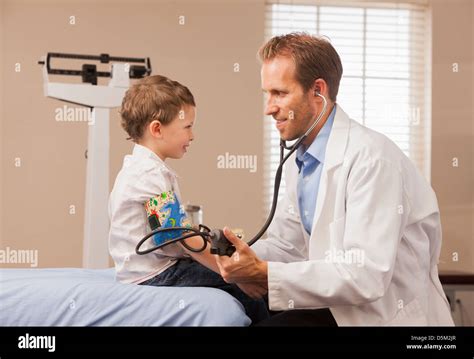 Pediatrician Checking Blood Pressure Of Boy 2 3 Stock Photo Alamy