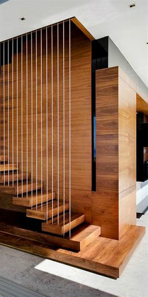 This contemporary living room features a modern wrought iron railing with detailed support balusters. 45+ Awesome Stair Railing Ideas | Stairs in living room ...