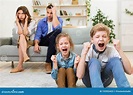 Naughty Children Misbehaving Screaming Sitting Near Exhausted Parents ...