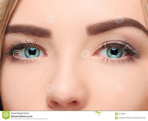 Cthe Lose Up Face Of Pretty Girl With Beautiful Big Blue Eyes Stock