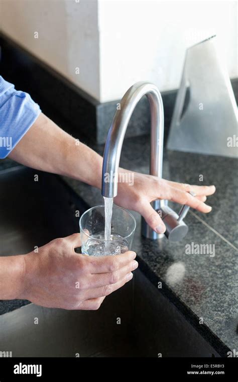 Man Drinking Glass Of Water Stock Photo Alamy