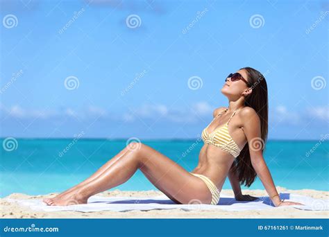 Women Tanning At The Beach