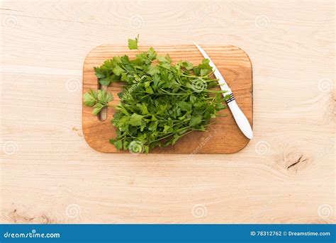 Parsley On A Board For Cutting And Cooking Stock Photo Image Of Knife
