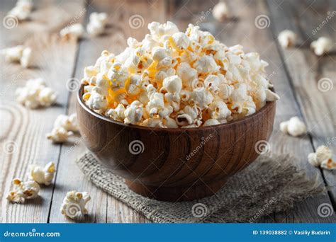 A Wooden Bowl Of Salted Popcorn On Rustic Table Stock Photo Image Of