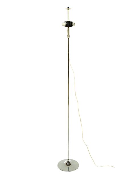 Inspired by the great outdoors, this beautiful uplight floor lamp design features acrylic hard plastic and a tree branch base. Chrome Tulip Floor Lamp | Chairish