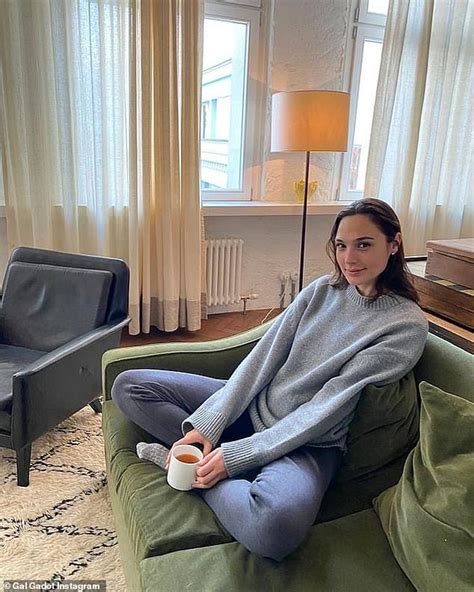 Gal Gadot Covers Up Her Bump As She Curls Up On The Couch With A Mug In