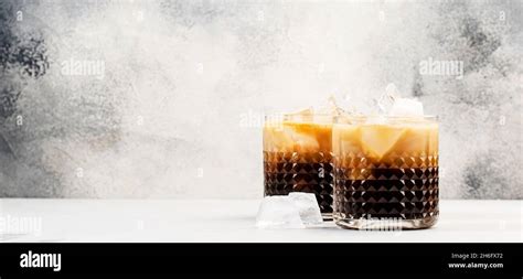 white russian cocktail trendy alcoholic drink with vodka coffee liqueur cream and ice gray