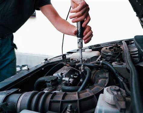 Car Repair Auto Mechanic Working On Car Engine In Mechanics Garage