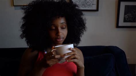 Young Black Woman Drinking Tea Or Coffee At Home Stock Video Footage 00