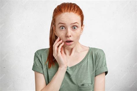 Free Photo Portrait Of Amazed Red Haired Female Model With Surprised