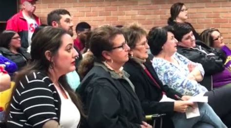 a teacher was handcuffed after questioning the superintendent s pay raise at a school board meeting