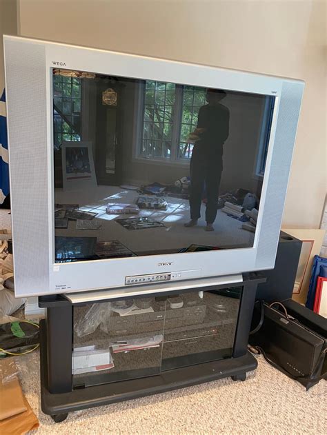 Sold Price Sony Trinitron 36” Color Tube Tv With Glass Door Television Stand On Wheels