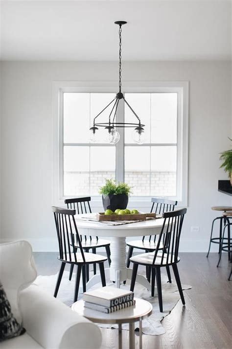 After spending countless hours researching. Pairing Black Windsor chairs with a round white pedestal ...